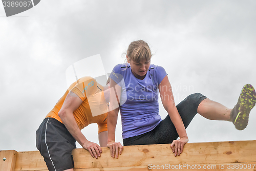 Image of Teams storm wall in extrim race. Bastion stage