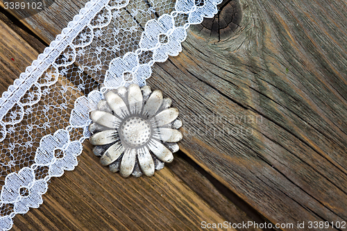 Image of vintage button and lace tape