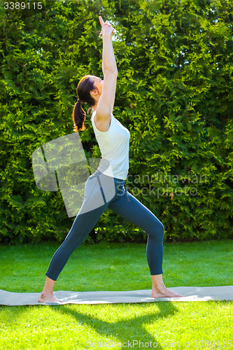 Image of young woman doing yoga