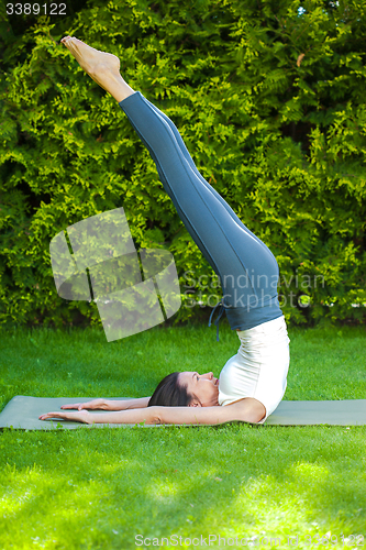 Image of pretty woman practicing yoga