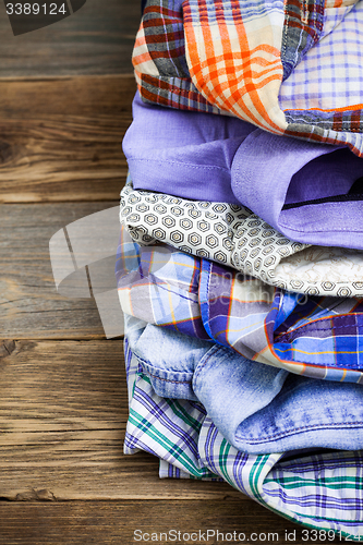 Image of stack of colored shirts