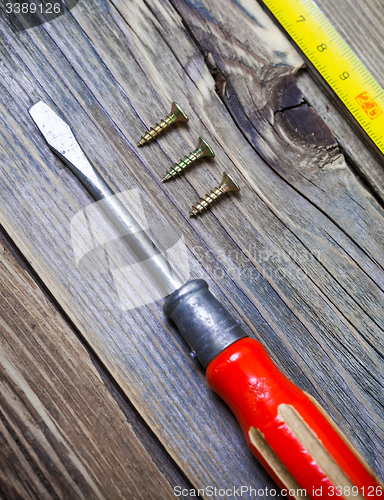 Image of old screwdriver and screws
