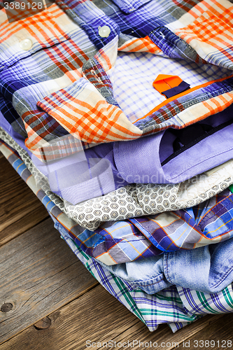 Image of bright shirts in a pile