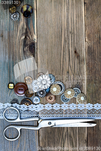 Image of vintage buttons, lace, and a dressmaker scissors