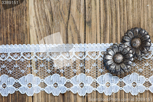 Image of vintage button and lace tape