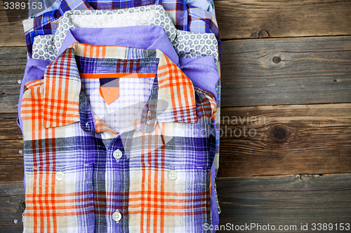 Image of bright shirts in a pile