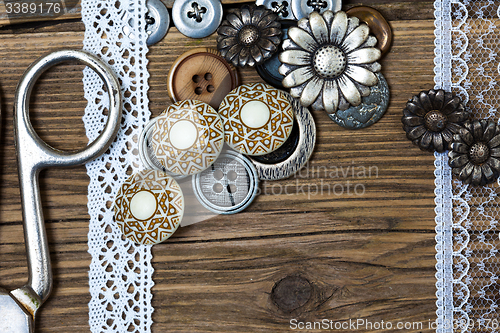 Image of vintage buttons, lace, and a tailor scissors