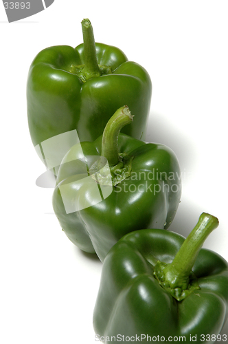 Image of three green peppers vertical