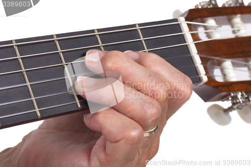 Image of Old hand and guitar isolated