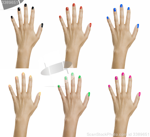 Image of Woman hands with colorful nail varnish