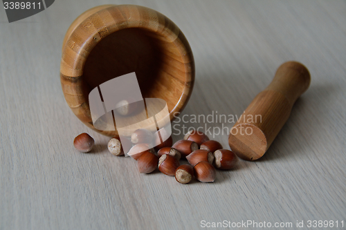 Image of mortar, pestle, and nuts 