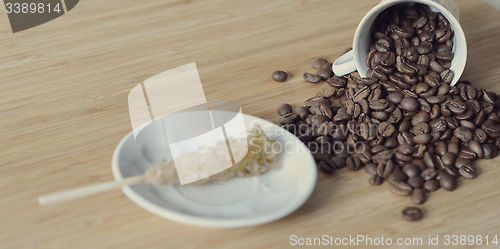 Image of coffee beans and a sugar stick