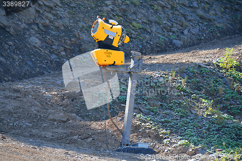 Image of road  and snow-making cannon