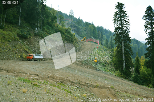 Image of road  with vehicles working