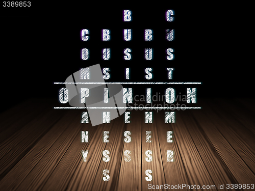 Image of Advertising concept: word Opinion in solving Crossword Puzzle