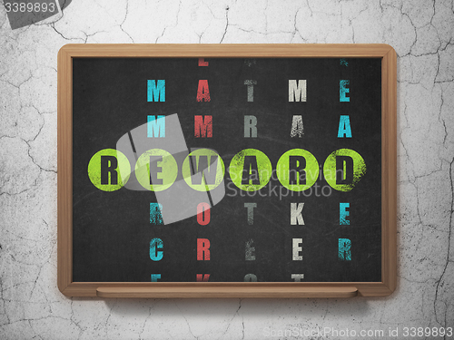 Image of Business concept: word Reward in solving Crossword Puzzle