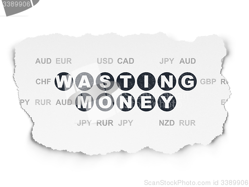 Image of Banking concept: Wasting Money on Torn Paper background