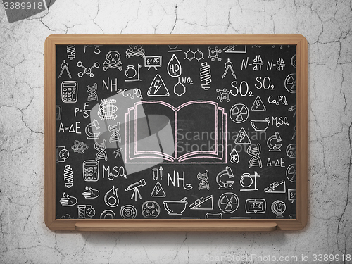 Image of Science concept: Book on School Board background