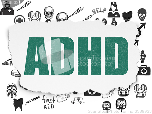 Image of Healthcare concept: ADHD on Torn Paper background