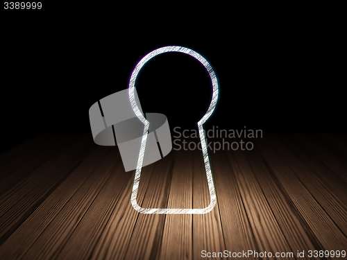 Image of Data concept: Keyhole in grunge dark room