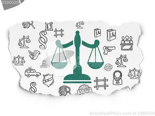 Image of Law concept: Scales on Torn Paper background