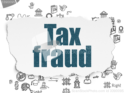 Image of Law concept: Tax Fraud on Torn Paper background