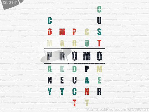 Image of Advertising concept: word Promo in solving Crossword Puzzle