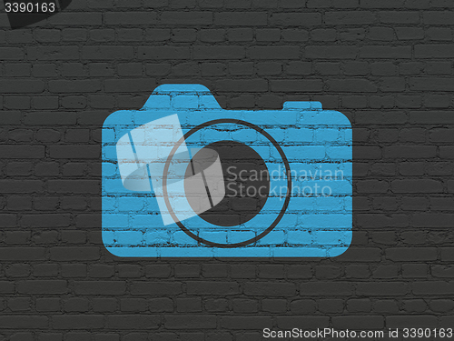 Image of Vacation concept: Photo Camera on wall background
