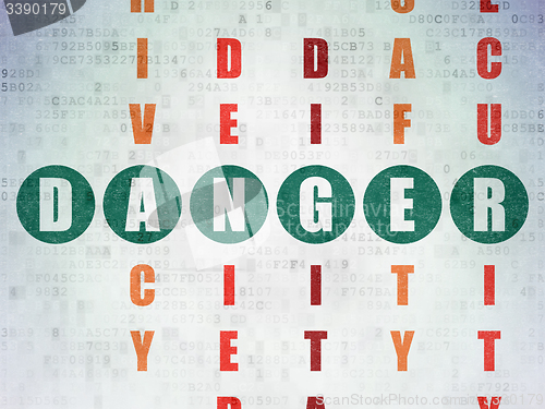 Image of Safety concept: word Danger in solving Crossword Puzzle