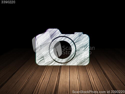 Image of Vacation concept: Photo Camera in grunge dark room