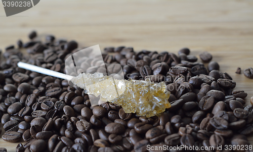 Image of coffee and sugar on the wooden board