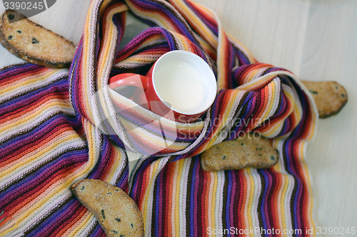 Image of hot milk wrapped in scarf