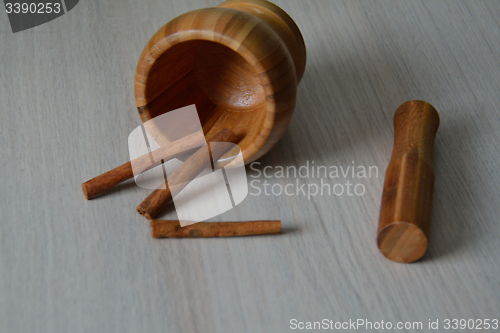 Image of mortar and cinnamon on the table