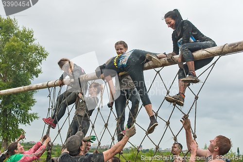 Image of Team storms net wall in extrim race. Tyumen.Russia