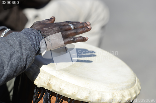 Image of hands of musician playing the tomtoms
