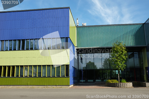 Image of modern building with blue and green color wall 