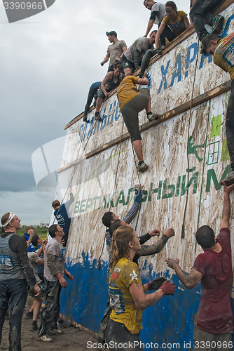 Image of Team storms big wall in extrim race. Tyumen.Russia
