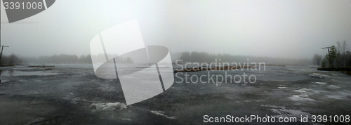 Image of forest lake in the spring in the fog