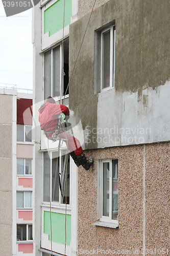 Image of specialist carring out warming of building