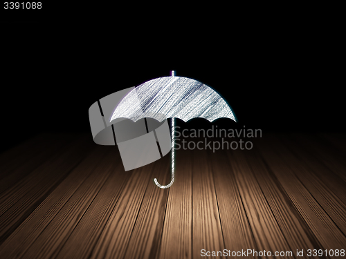 Image of Privacy concept: Umbrella in grunge dark room