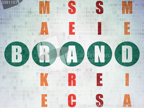Image of Marketing concept: word Brand in solving Crossword Puzzle