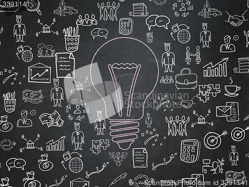 Image of Business concept: Light Bulb on School Board background