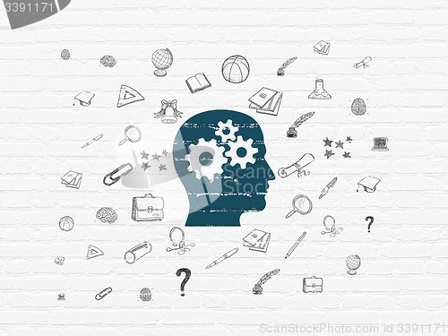 Image of Education concept: Head With Gears on wall background