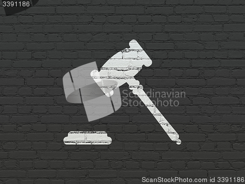 Image of Law concept: Gavel on wall background