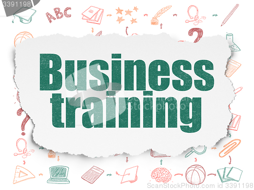 Image of Learning concept: Business Training on Torn Paper background