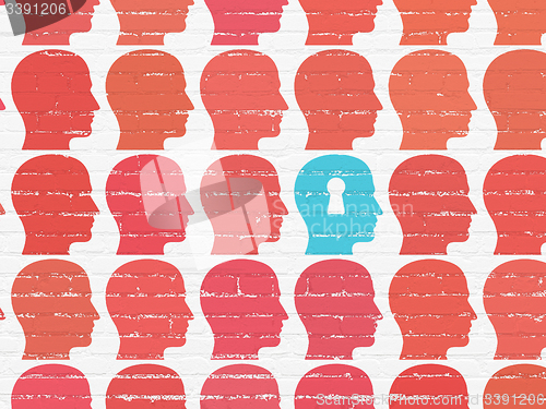 Image of Finance concept: head with keyhole icon on wall background