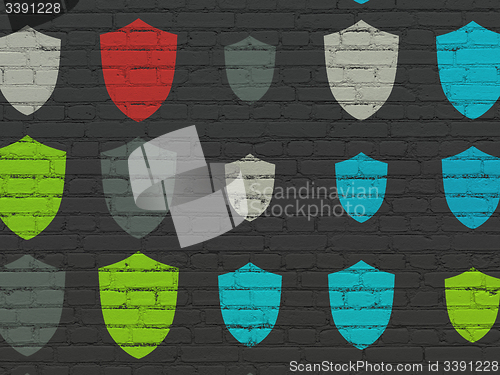 Image of Security concept: Shield icons on wall background