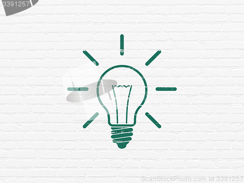 Image of Business concept: Light Bulb on wall background