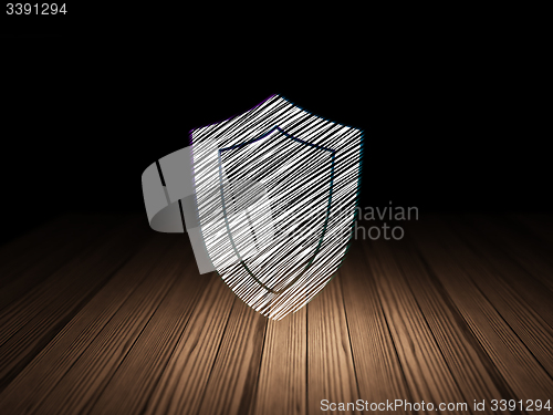 Image of Safety concept: Shield in grunge dark room
