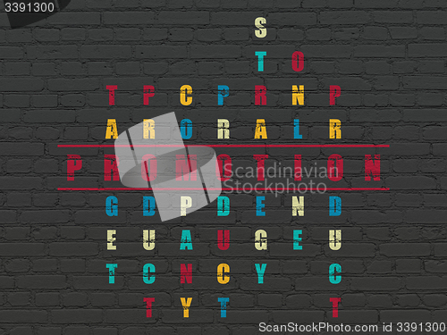 Image of Advertising concept: word Promotion in solving Crossword Puzzle